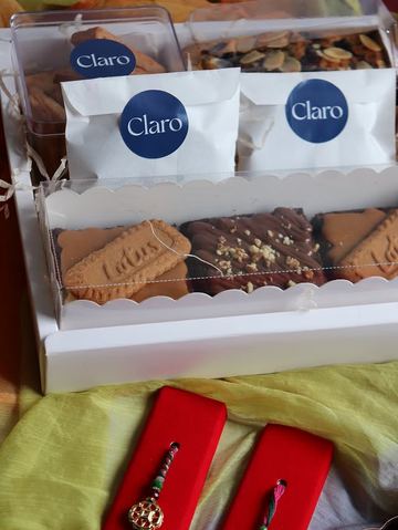 Claro Bakehouse branded packaging with cookies and brownies